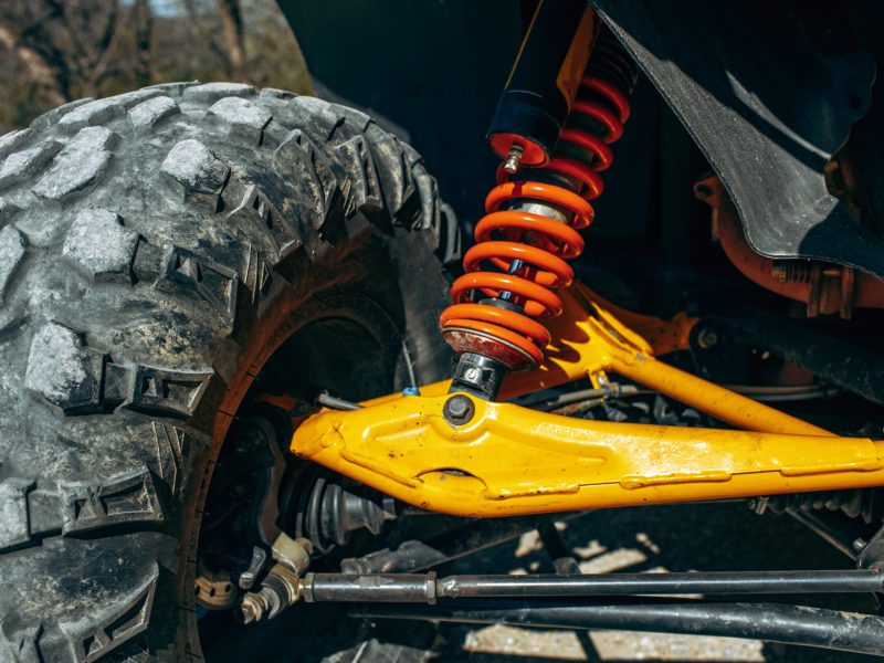 Shock absorber of ATV car close up photo
